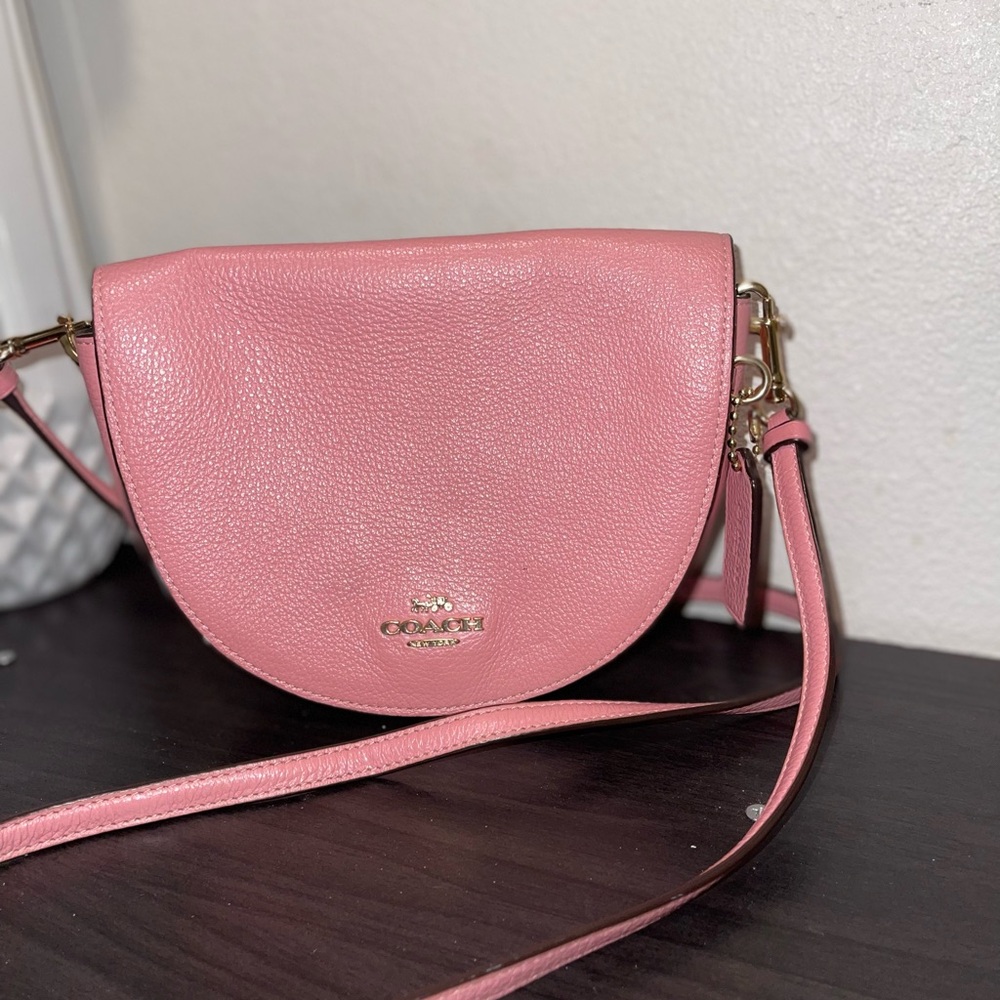 Coach Pink Crossbody Bag with Adjustable Strap and Saddle Shape